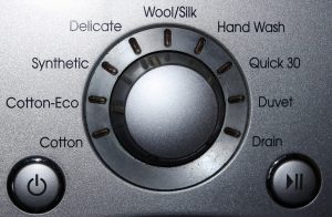 Wasmachine knop met allerlei opties